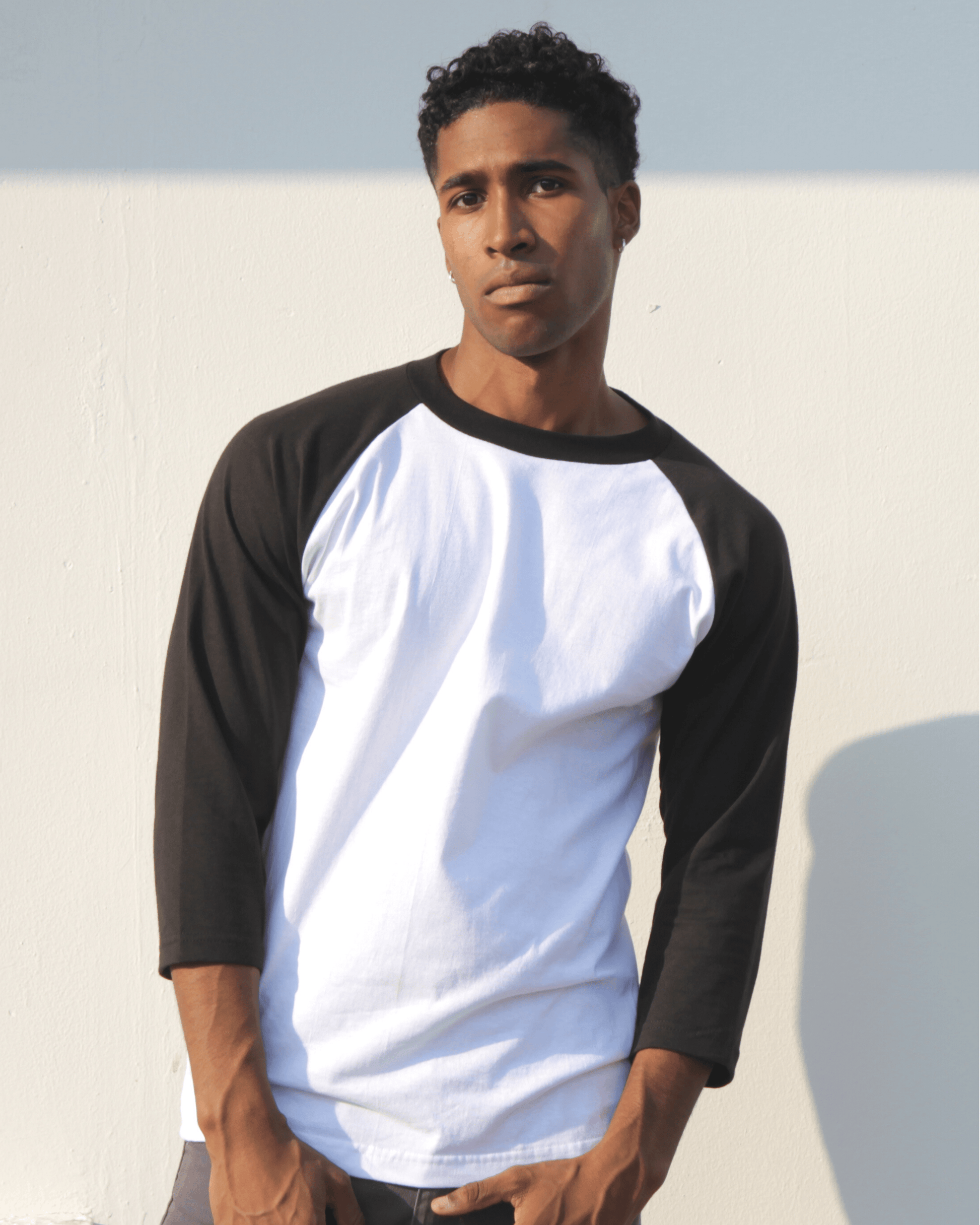 Young Man wearing Suna Cotton® Black and White Baseball T-shirt